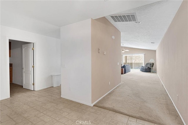 14303 Schooner Dr, Helendale, CA 92342 - hallway with lofted ceiling, baseboards, and a textured ceiling