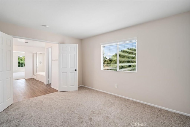 2207 Cork Oak St, Palmdale, CA 93551 - unfurnished bedroom with multiple windows, carpet, and baseboards
