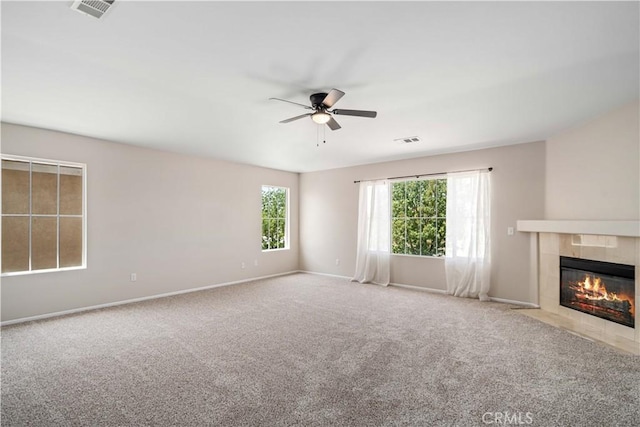 2207 Cork Oak St, Palmdale, CA 93551 - unfurnished living room with a ceiling fan, carpet flooring, a fireplace, and baseboards