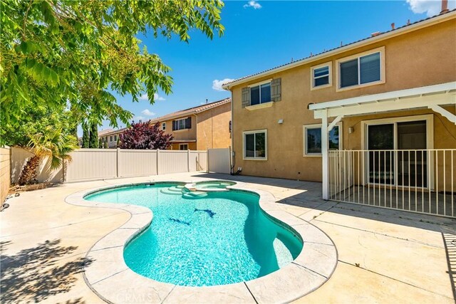 2207 Cork Oak St, Palmdale, CA 93551 - view of pool featuring a fenced backyard, a patio, and a pool with connected hot tub