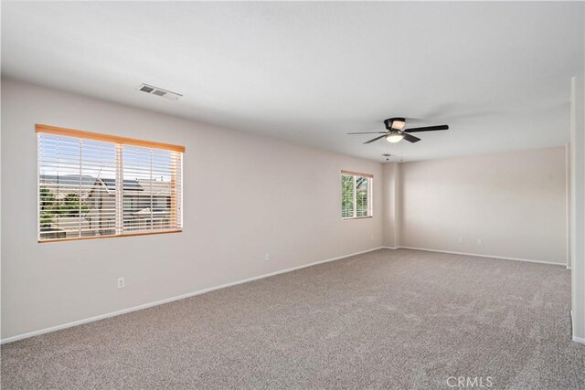 2207 Cork Oak St, Palmdale, CA 93551 - empty room featuring a ceiling fan, carpet, and baseboards