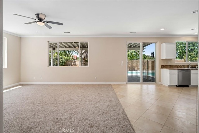 2207 Cork Oak St, Palmdale, CA 93551 - unfurnished living room with crown molding, healthy amount of natural light, light tile patterned floors, ceiling fan, and a sink