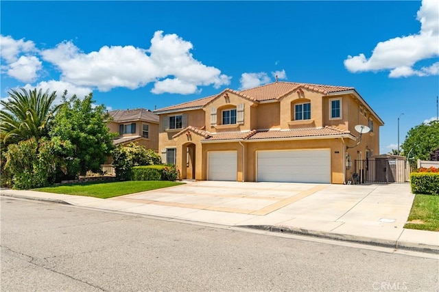 2207 Cork Oak St, Palmdale, CA 93551 - mediterranean / spanish home with a garage, a tiled roof, stucco siding, concrete driveway, and a gate