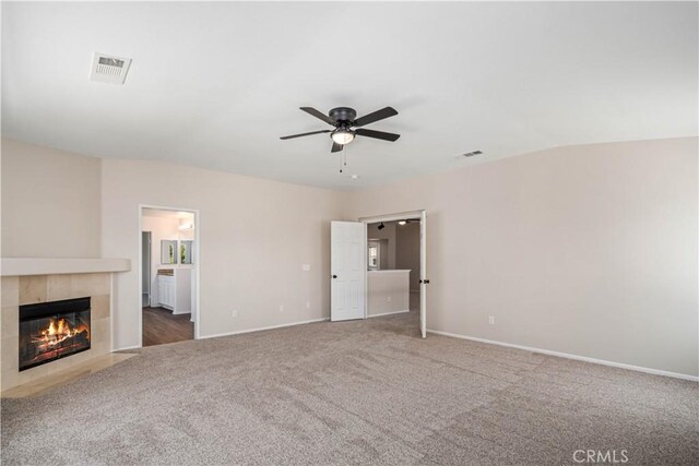 2207 Cork Oak St, Palmdale, CA 93551 - unfurnished living room with ceiling fan, carpet flooring, a fireplace, and baseboards