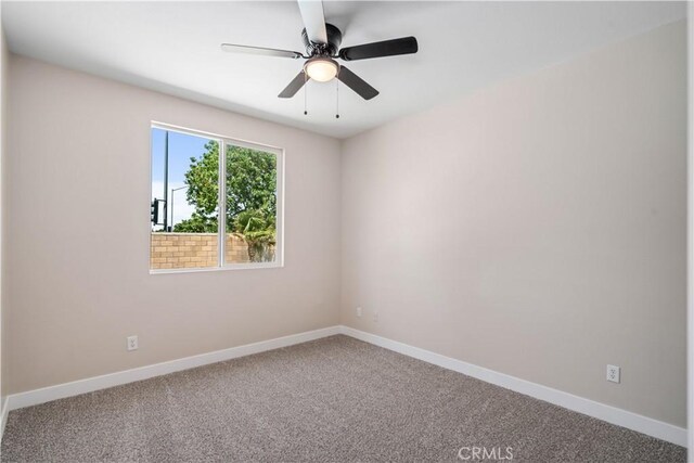 2207 Cork Oak St, Palmdale, CA 93551 - unfurnished room with carpet floors, baseboards, and ceiling fan