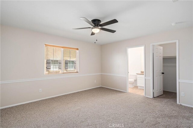 2207 Cork Oak St, Palmdale, CA 93551 - unfurnished bedroom featuring light carpet, a walk in closet, baseboards, ensuite bath, and a closet