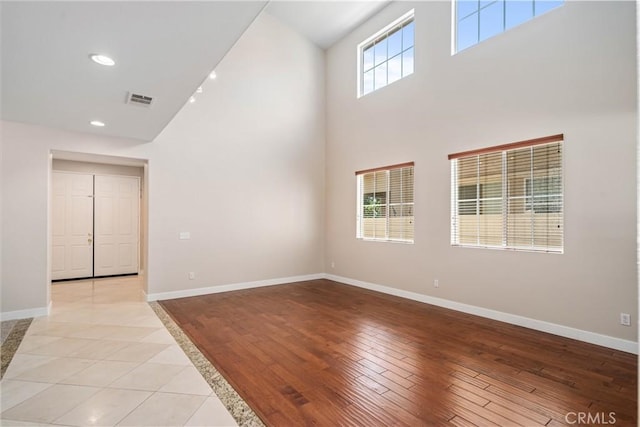 2207 Cork Oak St, Palmdale, CA 93551 - spare room featuring high vaulted ceiling, baseboards, and light wood-style flooring