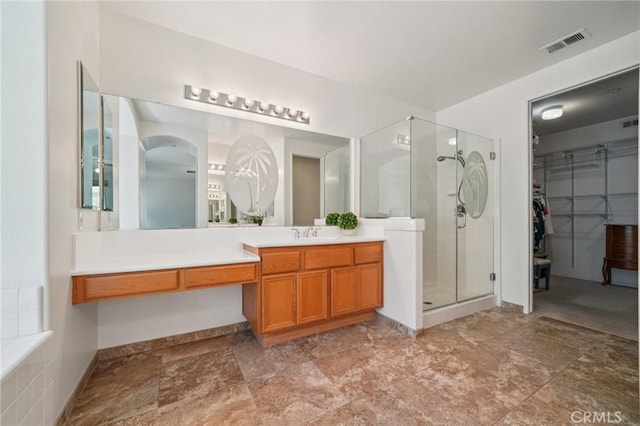 2583 Steeplechase Way, Norco, CA 92860 - full bathroom with a shower stall, vanity, a walk in closet, and stone finish floors