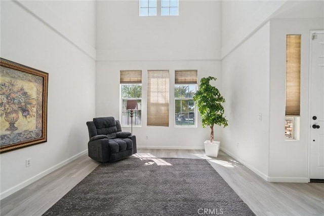 2583 Steeplechase Way, Norco, CA 92860 - sitting room with wood finished floors, a high ceiling, and baseboards