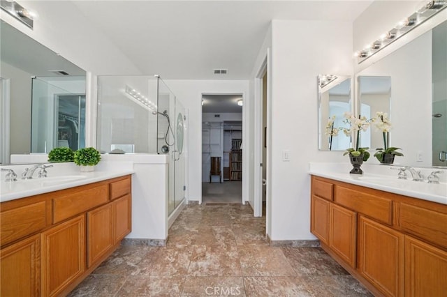 2583 Steeplechase Way, Norco, CA 92860 - full bathroom with two vanities, a stall shower, a spacious closet, and stone finish flooring