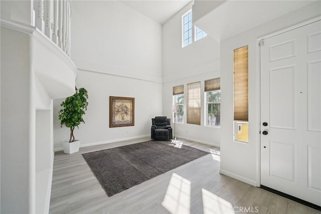 2583 Steeplechase Way, Norco, CA 92860 - entryway with a towering ceiling, light wood-style flooring, and baseboards