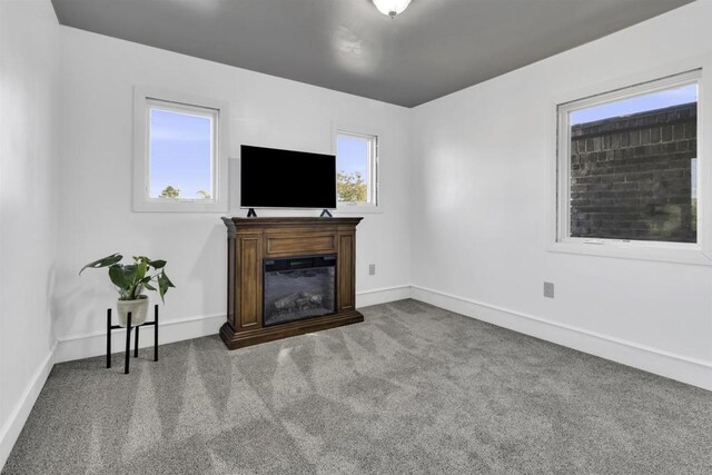 3388 Bancroft St, San Diego, CA 92104 - carpeted living area with baseboards and a glass covered fireplace