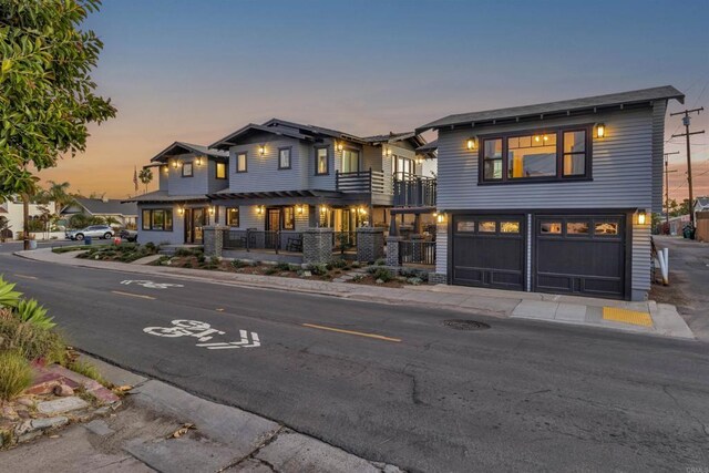 3388 Bancroft St, San Diego, CA 92104 - view of front of property with a garage, covered porch, and a balcony