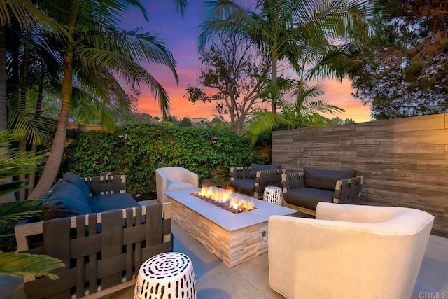 6599 Halite Pl, Carlsbad, CA 92009 - patio terrace at dusk with an outdoor living space with a fire pit and a patio