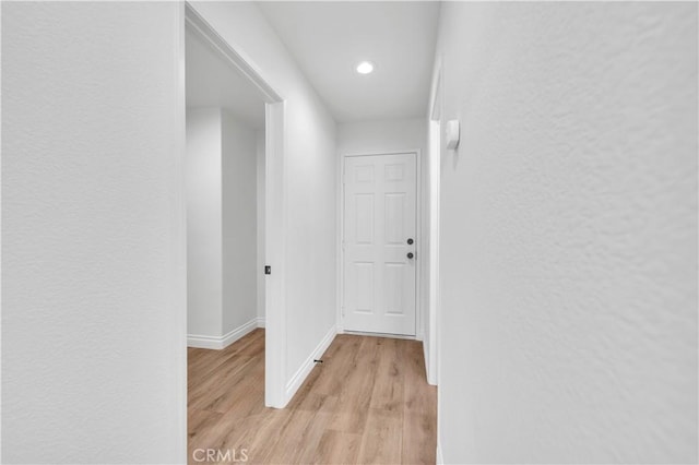 29 Villa Valtelena, Lake Elsinore, CA 92532 - corridor with light wood-style floors, baseboards, recessed lighting, and a textured wall
