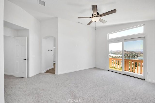 29 Villa Valtelena, Lake Elsinore, CA 92532 - unfurnished room featuring carpet floors, arched walkways, ceiling fan, and baseboards