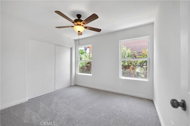 29 Villa Valtelena, Lake Elsinore, CA 92532 - unfurnished bedroom with carpet, a closet, baseboards, and ceiling fan