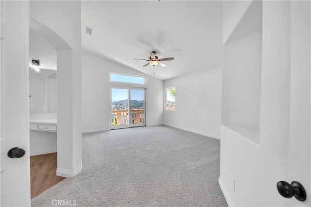 29 Villa Valtelena, Lake Elsinore, CA 92532 - carpeted spare room with a ceiling fan, lofted ceiling, arched walkways, and baseboards