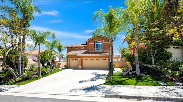 29 Villa Valtelena, Lake Elsinore, CA 92532 - mediterranean / spanish home with an attached garage, a tiled roof, stucco siding, and concrete driveway
