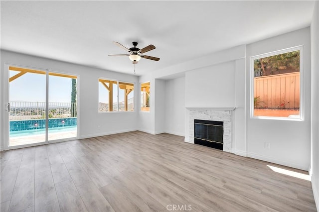 29 Villa Valtelena, Lake Elsinore, CA 92532 - unfurnished living room featuring ceiling fan, plenty of natural light, and wood finished floors