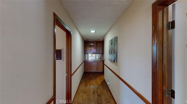 13889 Olathe Rd, Apple Valley, CA 92307 - hallway featuring dark wood-style flooring