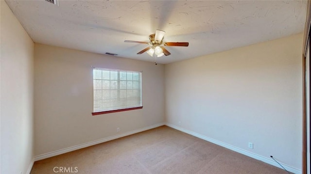 13889 Olathe Rd, Apple Valley, CA 92307 - unfurnished room featuring ceiling fan, light colored carpet, and baseboards