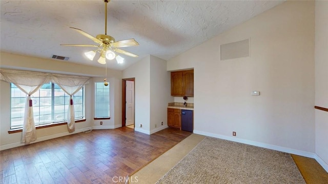 13889 Olathe Rd, Apple Valley, CA 92307 - spare room featuring lofted ceiling, ceiling fan, a textured ceiling, baseboards, and wood finished floors