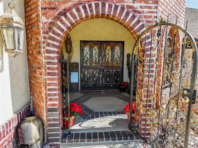 13889 Olathe Rd, Apple Valley, CA 92307 - doorway to property featuring brick siding