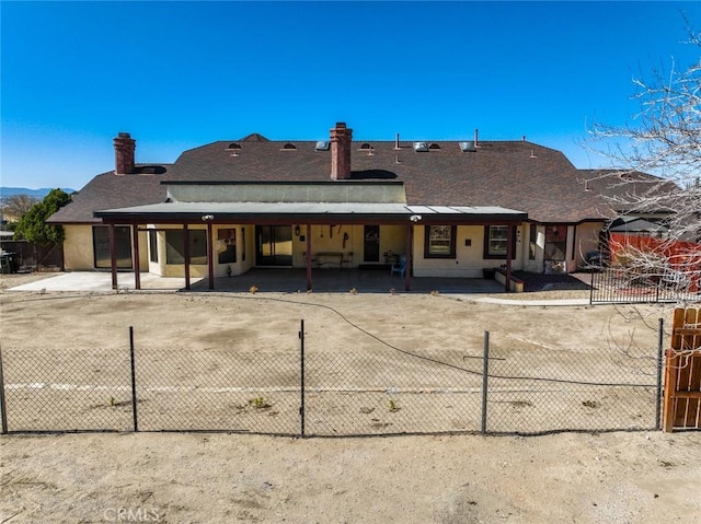 13889 Olathe Rd, Apple Valley, CA 92307 - rear view of house featuring a chimney and a shingled roof