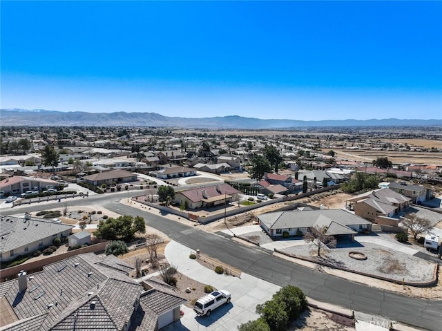 13889 Olathe Rd, Apple Valley, CA 92307 - aerial perspective of suburban area with a mountainous background