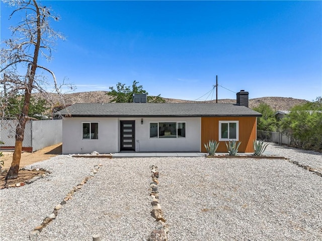 61730 Oleander Dr, Joshua Tree, CA 92252 - ranch-style house with a chimney, a patio area, and roof with shingles