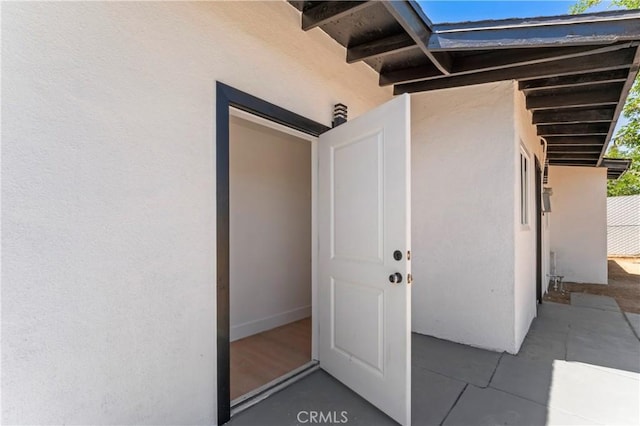 61730 Oleander Dr, Joshua Tree, CA 92252 - doorway to property with stucco siding