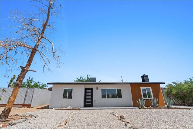 61730 Oleander Dr, Joshua Tree, CA 92252 - view of front of home featuring a chimney and stucco siding