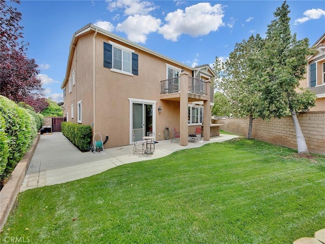 20361 Julia Ln, Saugus, CA 91350 - back of house with a balcony, stucco siding, and a patio area