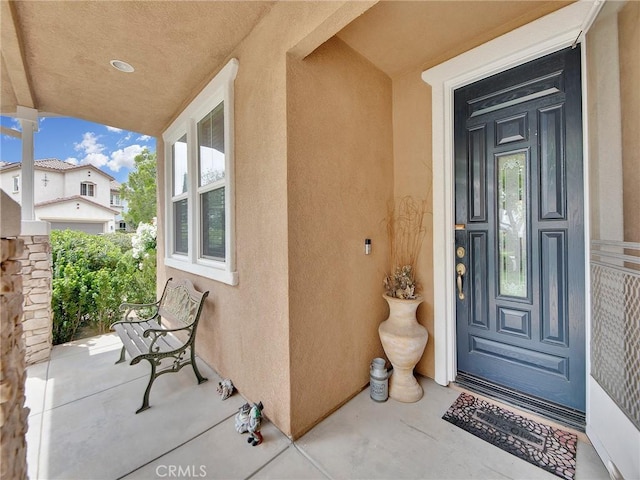 20361 Julia Ln, Saugus, CA 91350 - doorway to property featuring stucco siding and covered porch