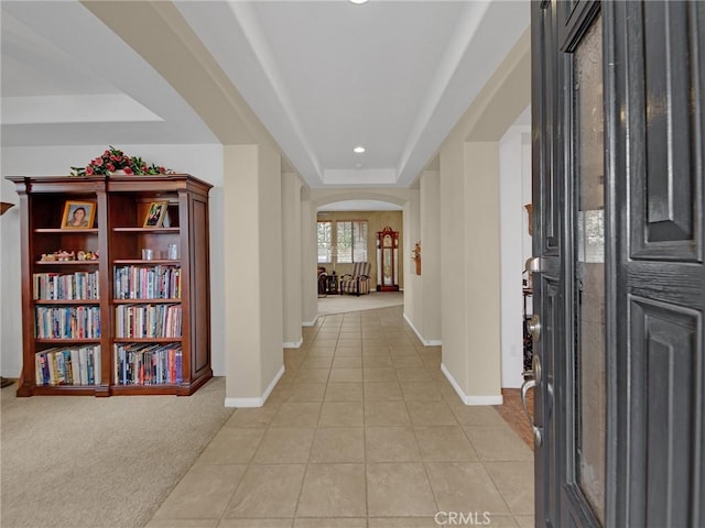 20361 Julia Ln, Saugus, CA 91350 - entrance foyer featuring arched walkways, a raised ceiling, light tile patterned floors, baseboards, and recessed lighting