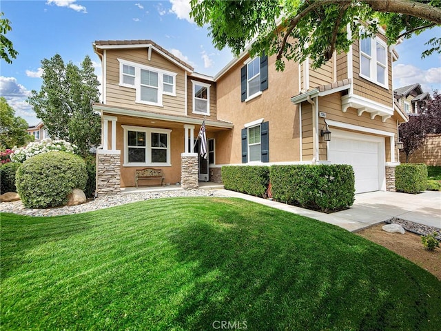 20361 Julia Ln, Saugus, CA 91350 - view of front of house featuring stone siding, an attached garage, a front yard, and driveway