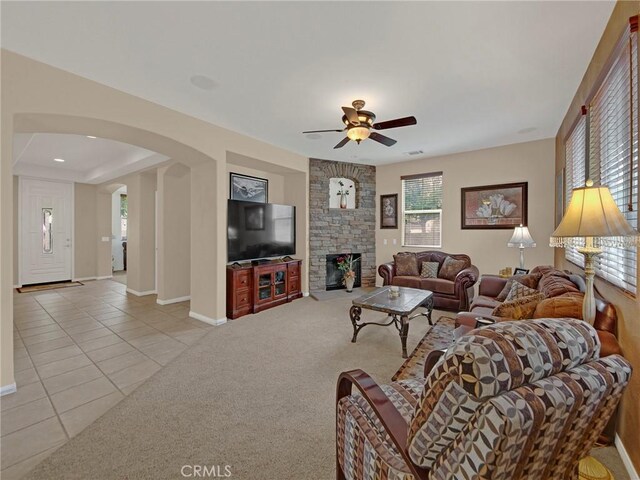20361 Julia Ln, Saugus, CA 91350 - carpeted living area featuring tile patterned floors, a ceiling fan, healthy amount of natural light, and baseboards