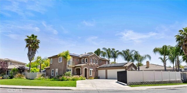 35616 Suzette Ct, Winchester, CA 92596 - mediterranean / spanish-style home featuring solar panels, driveway, a garage, and stucco siding