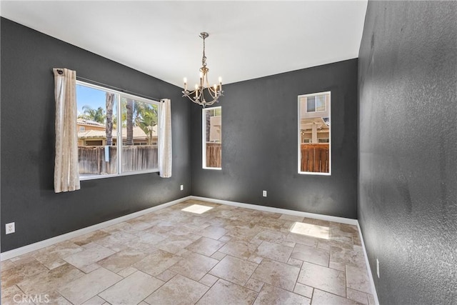 35616 Suzette Ct, Winchester, CA 92596 - empty room with a chandelier, stone tile flooring, and baseboards