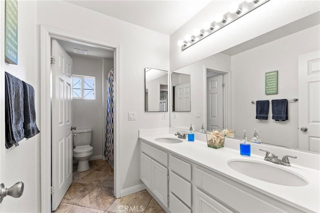 35616 Suzette Ct, Winchester, CA 92596 - bathroom with toilet, double vanity, tile patterned flooring, and baseboards