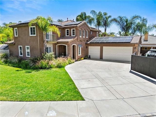 35616 Suzette Ct, Winchester, CA 92596 - mediterranean / spanish home featuring solar panels, concrete driveway, stucco siding, a garage, and a front yard