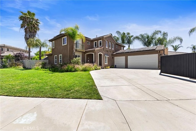 35616 Suzette Ct, Winchester, CA 92596 - view of front of home with roof mounted solar panels, concrete driveway, stucco siding, and a garage