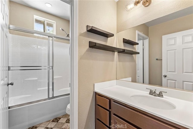 35616 Suzette Ct, Winchester, CA 92596 - bathroom featuring toilet, vanity, and combined bath / shower with glass door