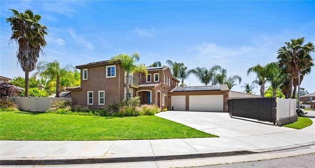 35616 Suzette Ct, Winchester, CA 92596 - view of front of home with solar panels, concrete driveway, stucco siding, an attached garage, and a gate