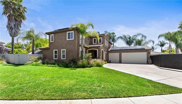 35616 Suzette Ct, Winchester, CA 92596 - view of front of house with stucco siding, roof mounted solar panels, an attached garage, and driveway