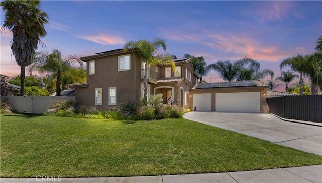 35616 Suzette Ct, Winchester, CA 92596 - view of front facade with roof mounted solar panels, stucco siding, concrete driveway, an attached garage, and a balcony