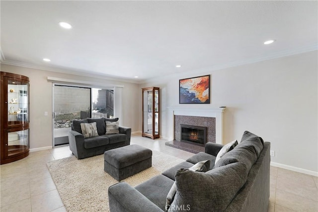 21848 Ute Way, Lake Forest, CA 92630 - living area with light tile patterned flooring, a glass covered fireplace, recessed lighting, crown molding, and baseboards