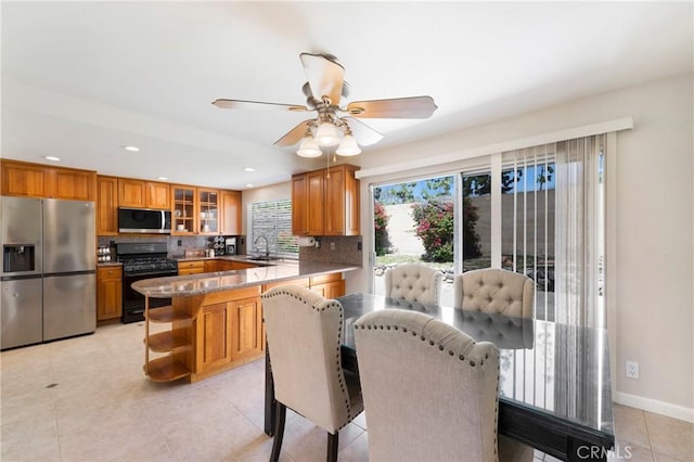 21848 Ute Way, Lake Forest, CA 92630 - dining space featuring light tile patterned floors, recessed lighting, ceiling fan, and baseboards