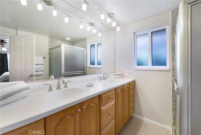 21848 Ute Way, Lake Forest, CA 92630 - bathroom featuring baseboards, double vanity, and a stall shower